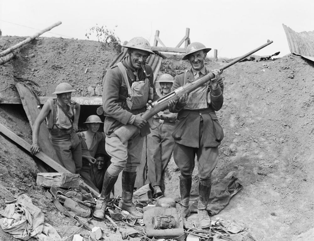 New Zealand soldiers in a German dug-out with a captured German anti-tank rifle, near Grévillers, 25 August 1918. 